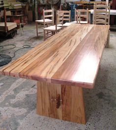 a large wooden table with chairs around it