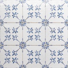 a blue and white tile pattern on the wall