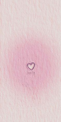 a pink wall with a heart drawn on it