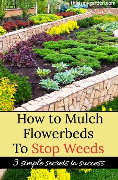 a garden filled with lots of flowers and plants next to a stone wall that says how to mulch flowers to stop weeds