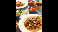 mexican food is on the table ready to be eaten for lunch or dinner, including guacamole and black beans