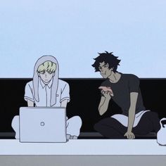 two people sitting on the ground with their laptops