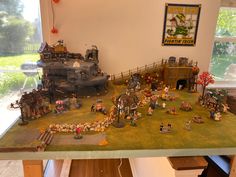 a table topped with lots of toy figurines