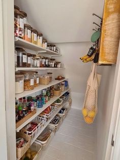 the pantry is stocked with many different types of food