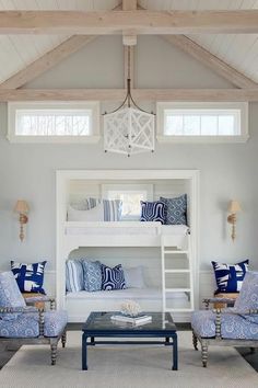 a living room filled with furniture and a bunk bed