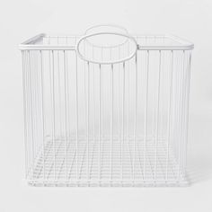 a white wire basket on a white background