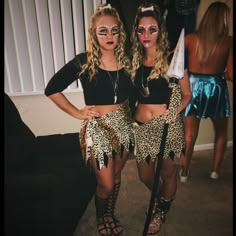 two women dressed up in animal print outfits