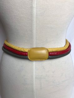 "Really fun puffy stacked leather belt~ fits a 31\" waist. Bright red, mustard yellow and khaki. The leather is very supple. Dominant color is the yellow. There's no label but I'm fairly sure it was made by Bogner or Mondi in the 1980's. (I bought dozens from an estate and most were these designers)  ✏️✏️✏️DETAILS ✏️✏️✏️ Brand: Bogner ? Size on tag: med Fits like: medium  Color: red yellow khaki  Material: leather  Condition: excellent  Item includes: belt  ✂ ✂️✂️  MEASUREMENTS ✂️✂️✂️ Length: 31 Suspender Belt, Portland Oregon, Belt Size, Suspenders, Bright Red, Mustard Yellow, Red Yellow, Leather Belt, Vintage Outfits