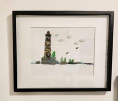 The scene in this 20"x25" black shadow box frame depicts the iconic lighthouse.  I've used seaglass collected from Sidney, Taylor  and Dallas Road beaches on Vancouver Island along with stones/pebbles I picked up from the Sooke tidal river to create my one of a kind vision of the Lighthouse. Beach Shadow Boxes, Sea Glass Crafts, Pebble Stone, Black Shadow, Artwork For Home, Coastal Landscape, Stone Crafts, Sea Glass Art, Glass Ideas