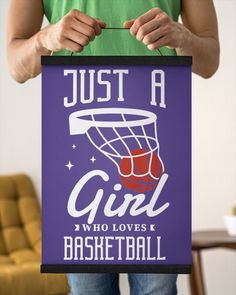 a person holding a sign that says just a girl who loves basketball