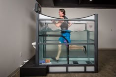 a man is running through a glass case