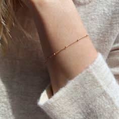 "We love the elegant look and lightweight feel of our 14k gold filled satellite bracelet. Alone or stacked, this dainty gold chain bracelet is the perfect everyday bracelet.  SIZING GUIDE * 6\" (XXS/XS) * 6.5\" (Small) * 7\" (Medium) * 7.5\" (Large/XL) Please see our photos to learn how to measure the perfect length. CRAFTSMANSHIP  Jewelry is handmade by us in our NYC studio. We focus on craftsmanship and quality using only the highest quality materials and handpicked genuine gemstones.  PACKAGING We take pride in creating beautifully packaged orders. Jewelry arrives delicately wrapped in tissue and placed in a kraft box inside a logo drawstring pouch. Your package will arrive nice enough to gift someone.  If you need your order by a certain date, it is very important to send us a message Everyday 14k Gold-filled Satellite Chain Bracelet, Delicate Gold Bracelet With Satellite Chain For Everyday, Delicate Gold Bracelet With Satellite Chain, Dainty Rose Gold Bracelets With Satellite Chain, Dainty 14k Gold Bracelet With Satellite Chain, Hypoallergenic Dainty Gold-filled Chain Bracelet, Dainty Rose Gold Bracelet With Satellite Chain, Hypoallergenic Dainty 14k Gold Filled Chain Bracelet, Hypoallergenic Dainty Gold Filled Chain Bracelet