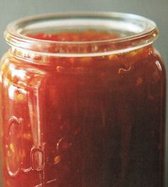 a jar filled with liquid sitting on top of a table