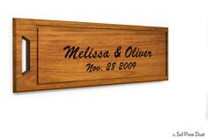 a wooden plaque with the name and date engraved on it