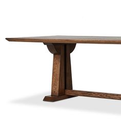 a wooden table with two legs and a long slab on one end, in the shape of a cross