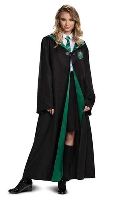 a woman in a harry potter costume is standing with her hands on her hips and looking at the camera