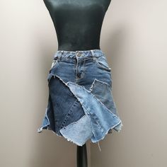 "Upcycled denim patchwork skirt with frayed seams. Waist measures 30\" and length is approximately 16\"." Patch Work Denim Skirt, Jean Skirt Outfits 2023, Denim Skirt Made From Jeans, Patchwork Skirt Denim, Reworked Blue Denim Skirt, Summer Denim Reworked Skirt, Casual Reworked Medium Wash Denim Skirt, Blue Reworked Denim Skirt, Recycled Denim Patchwork Skirt