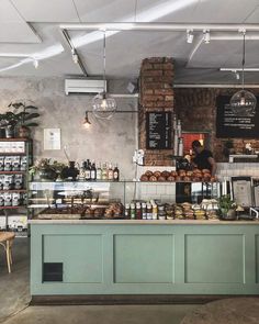 the inside of a coffee shop with various items on display