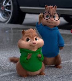 two chipmuns are standing next to each other in front of a car