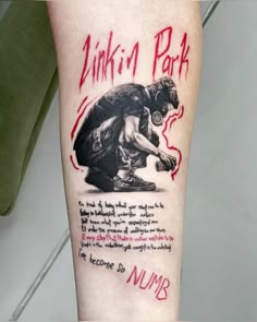 a person with a tattoo on their leg that reads, linking park and numr