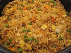 rice and peas are mixed together in a skillet