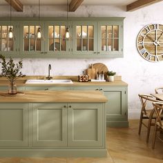 a kitchen with green cabinets and wooden counter tops next to a large clock on the wall