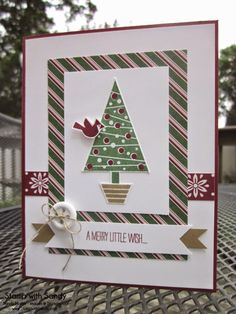 a card with a christmas tree and ribbon on the front, it says merry little wish