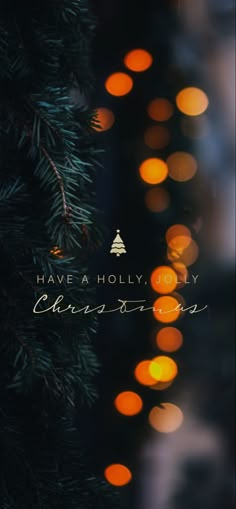 a christmas tree with blurry lights in the background that says have a holly holiday ornament