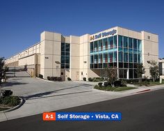 an office building with a sign that says self storage vista ca