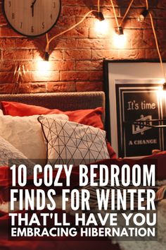 a bed with red sheets and pillows in front of a brick wall that reads, 10 cozy bedroom finds for winter that'll have you embracing liberation