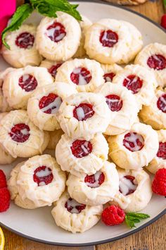 a plate full of raspberry shortbread cookies