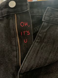 a pair of jeans with the words oh, it's us written on them