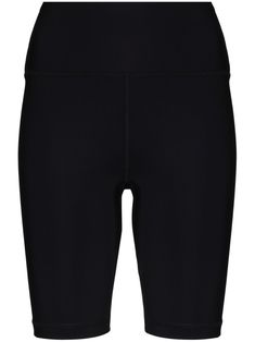 the back view of a woman's black shorts with high waist and side zippers