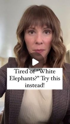 a woman holding up a sign that says tired of white elephants? try this instead