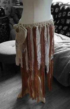 Handmade crochet ladies boho jellyfish skirt/utility belt with a woolen pouch which fastens  with a crafted coconut shell button.  This belt is made from undyed swaledale wool from the Yorkshire Dales UK, And is embellished with rags and lace. It fastens at the side with wooden beaded  ties. size large 14 to 18 🇬🇧 size Bohemian Beige Skirt For Festival, Bohemian Crochet Festival Skirt, Bohemian Beach Skirt With Crochet Trim, Crochet Utility Belt, Jellyfish Skirt, Crochet Belts, Moth Witch, Rag Skirt, Crochet Belt