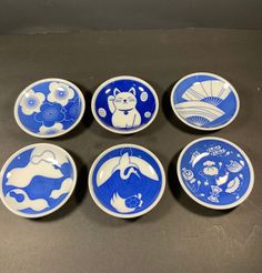 six blue and white plates with animals on them