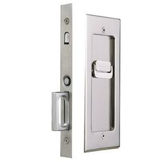 an open door handle and latch on a white background