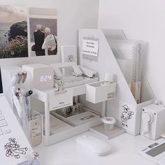 a white desk with various items on it