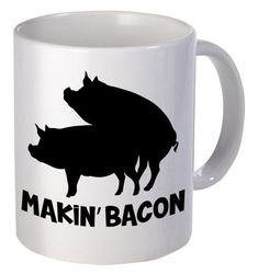 a white coffee mug with the words makin'bacon and two pigs on it