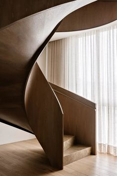 a spiral staircase in the corner of a room