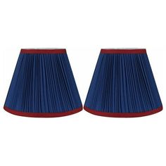 pair of blue lampshades with red trim