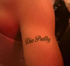 a person with a tattoo on their arm that says, die puffyy in cursive writing