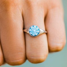 We're getting all the Pura Vida vibes from our new Cameo Ring! This island oasis of a ring comes with a light blue cameo flower and a silver finish that pairs perfectly with our Cameo Bracelets in any color! - Brass base with rhodium plating- Cameo flower dimensions: 9mm diameter- "pura vida" stamped on inside front of ring- Exchanges only Pura Vida Rings, Knockaround Sunglasses, Howlite Rings, Cameo Bracelet, Ring Exchange, Rainbow Rings, Pura Vida Bracelets, Sun With Sunglasses, Cameo Ring