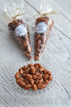 two bags of nuts sitting on top of a glass plate