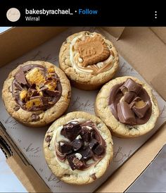 four cookies in a box with chocolate and peanut butter toppings on the top one