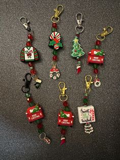 several christmas themed key chains on a table