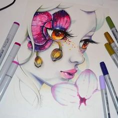 a drawing of a woman with flowers on her face and makeup brushes next to it