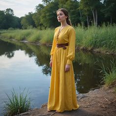 This handmade yellow dress embodies the timeless charm of medieval and Renaissance eras, featuring a classic Viking tunic design. Its lightweight linen fabric ensures comfort, making it perfect for festivals, cosplay, or any themed event. The leather belt adds a touch of rustic authenticity, while the lace-up front enhances its historical feel. Whether you're attending a Ren Faire, participating in a Viking reenactment, or simply looking for a unique costume, this dress offers versatility and elegance. Crafted with attention to detail, this dress is ideal for those seeking an authentic, comfortable, and stylish medieval look. I hope you will love my design as much as I enjoyed creating it for you! ----Important Information---- Please, be aware that all pictures are designer's illustrations Yellow Medieval Dress, Viking Tunic, Womens Yellow Dress, Viking Reenactment, Medieval Woman, Nordic Vikings, Tunic Designs, Unique Costumes, Medieval Dress