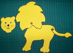 a paper cut out of a lion and a cat on a green background with lines