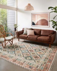 a living room filled with furniture and a rug